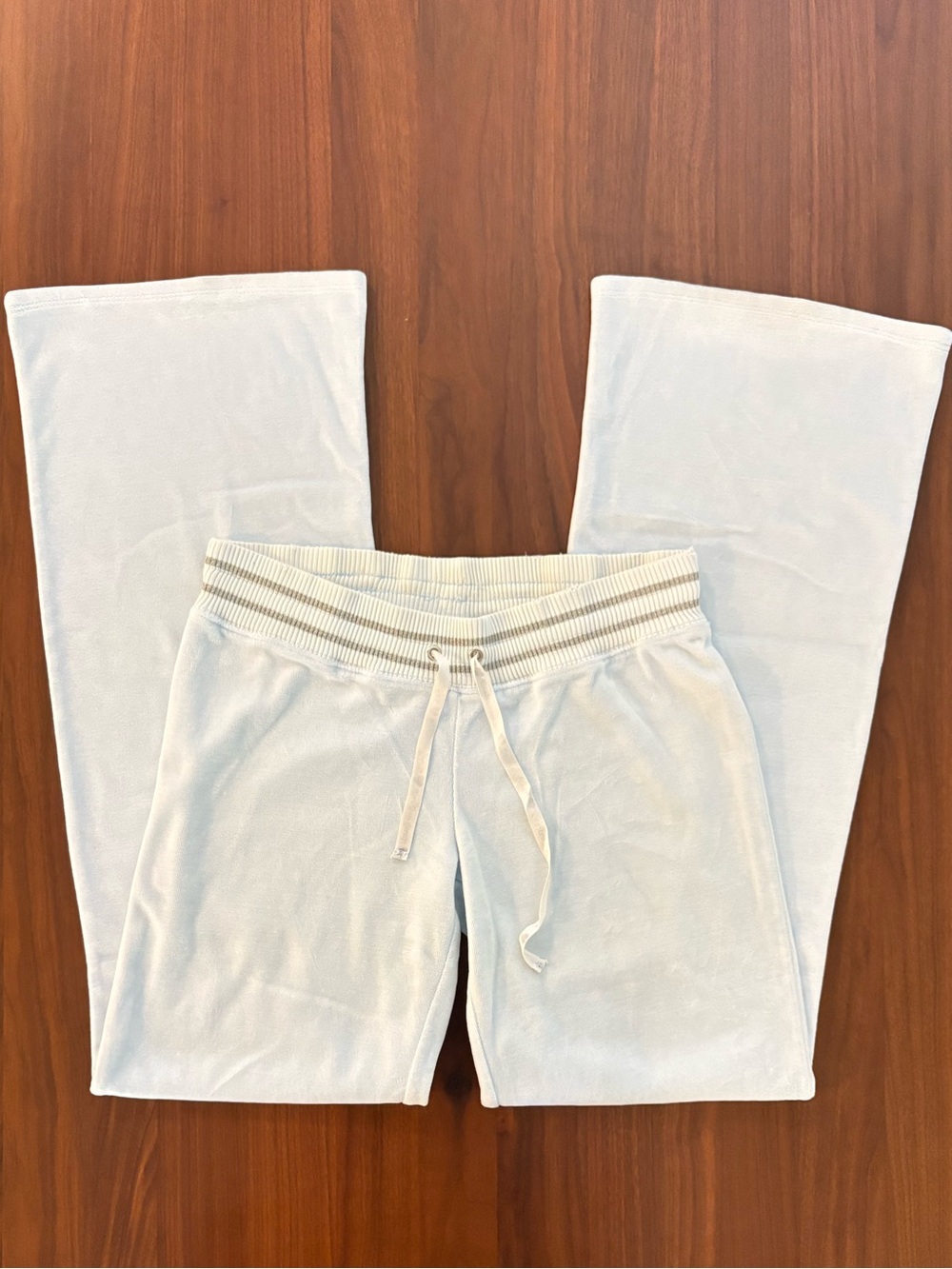 Y2K velour track pants in a soft baby blue